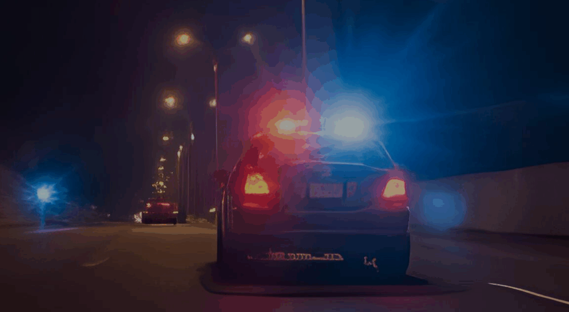cop pulling over a car for speeding